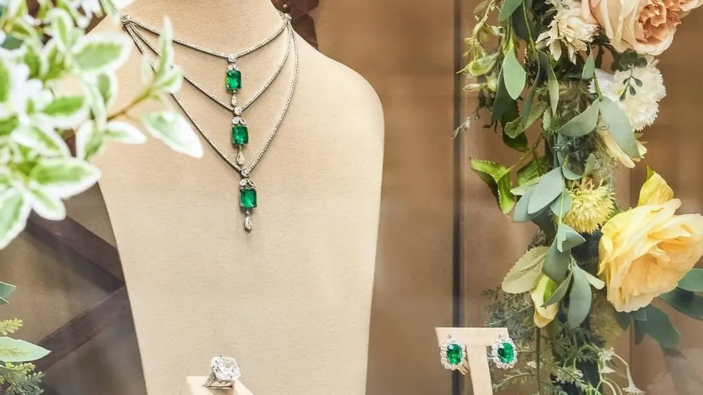  Elegant display of emerald and diamond jewellery at a luxury Mayfair jewellery shop