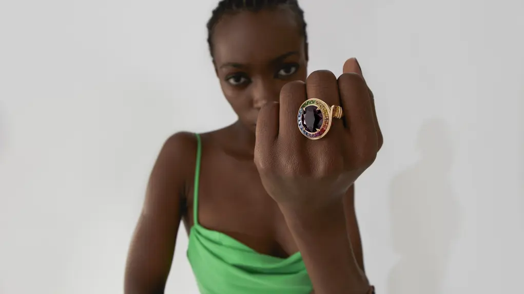 Model showcasing Stephen Webster statement ring with colourful gemstone