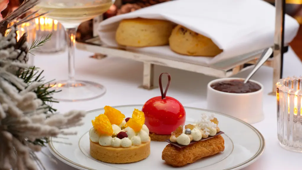 Festive afternoon tea desserts with scones and jam served elegantly for Christmas