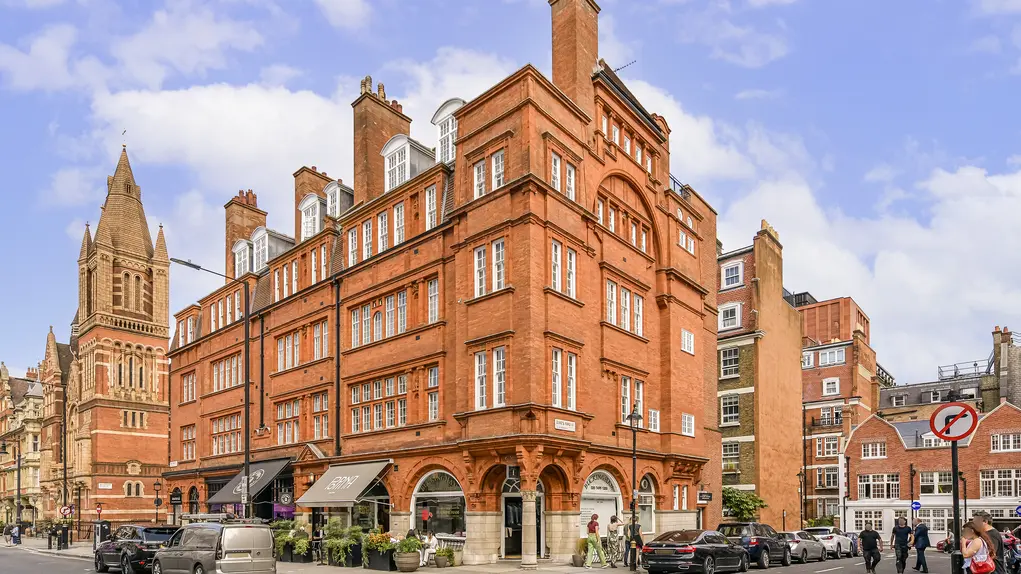 The corner of a building on Duke Street showing cafes on the ground floor