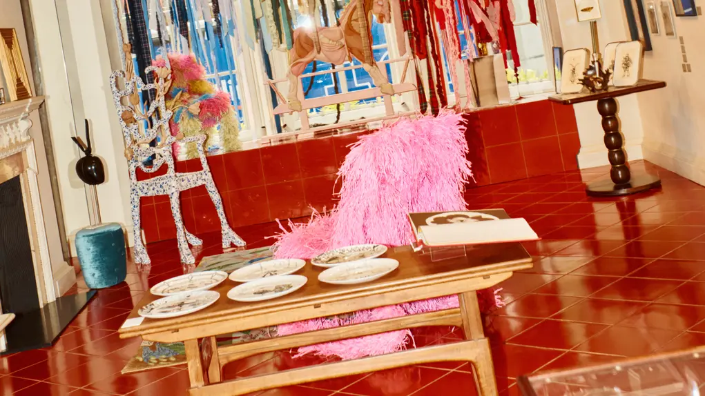 A table with artwork in the background 