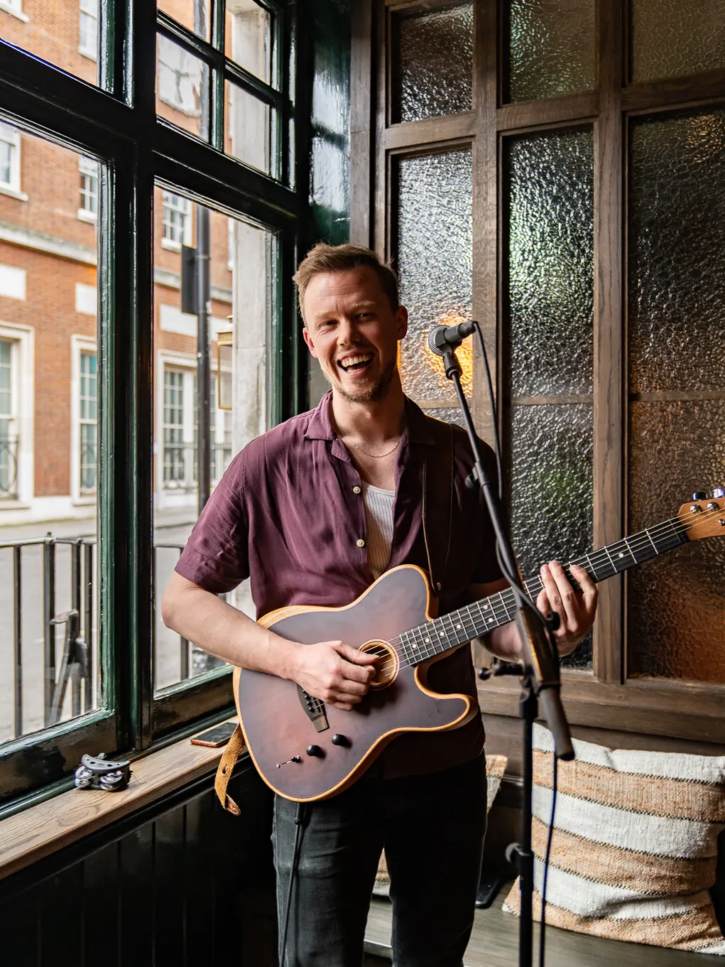 A guitarist performs at The Barley Mow