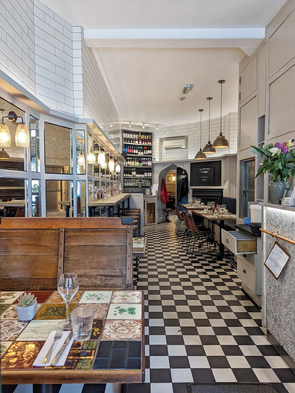 The interior of The Mayfair Chippy with its checkerboard tiles