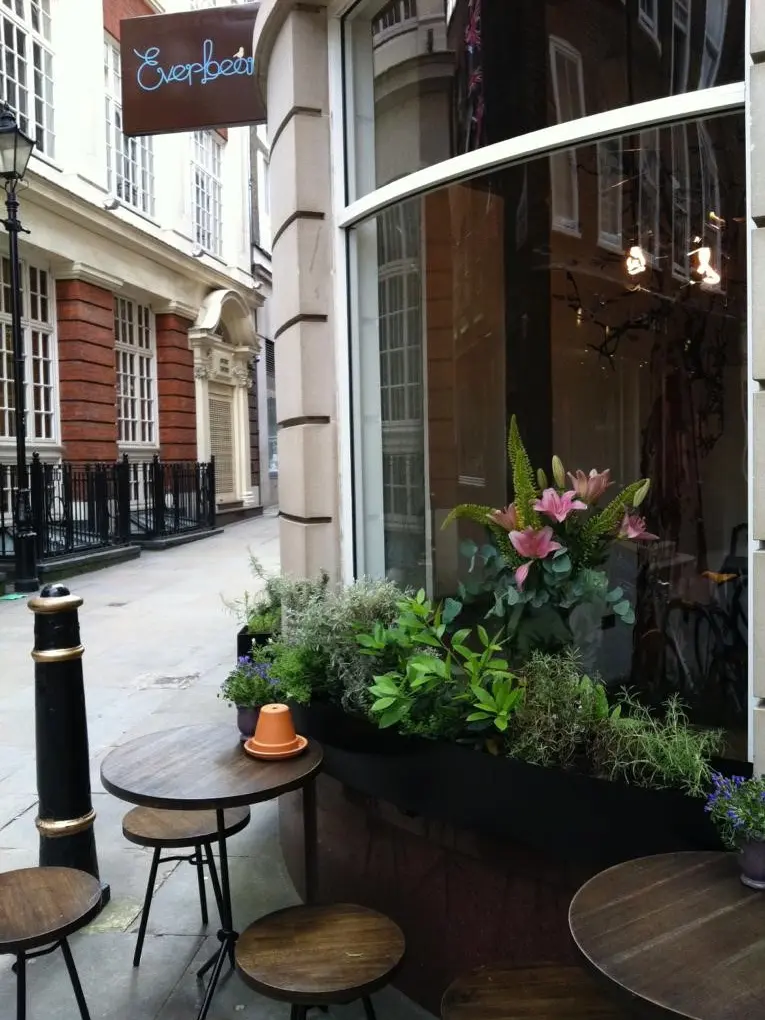 The outside of Everbean with tables on the pavement