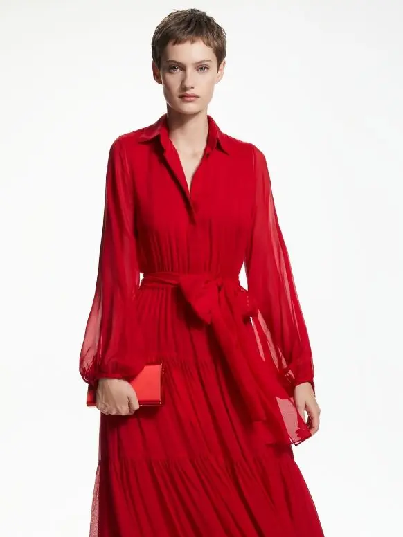 A woman in a red chiffon dress