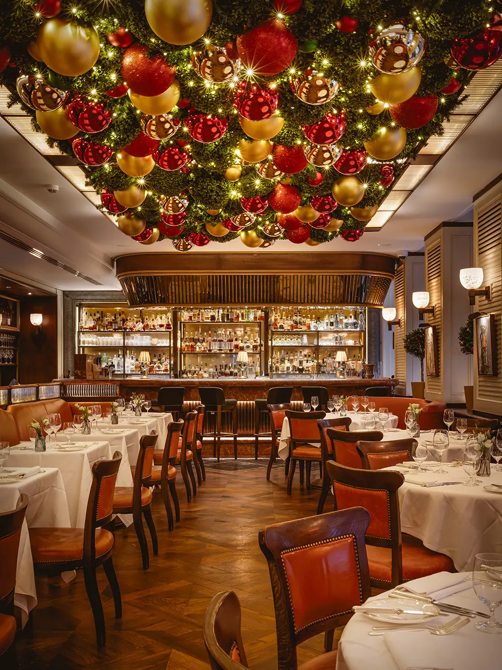 A dining room with baubles on the ceiling