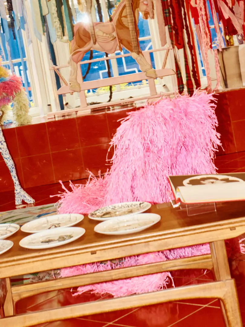 A table with artwork in the background 