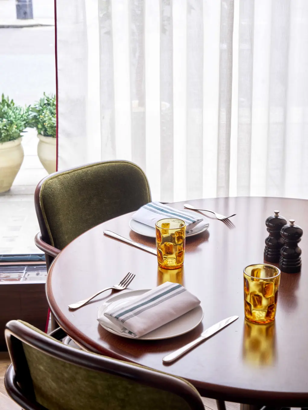 A table and chairs set for dinner