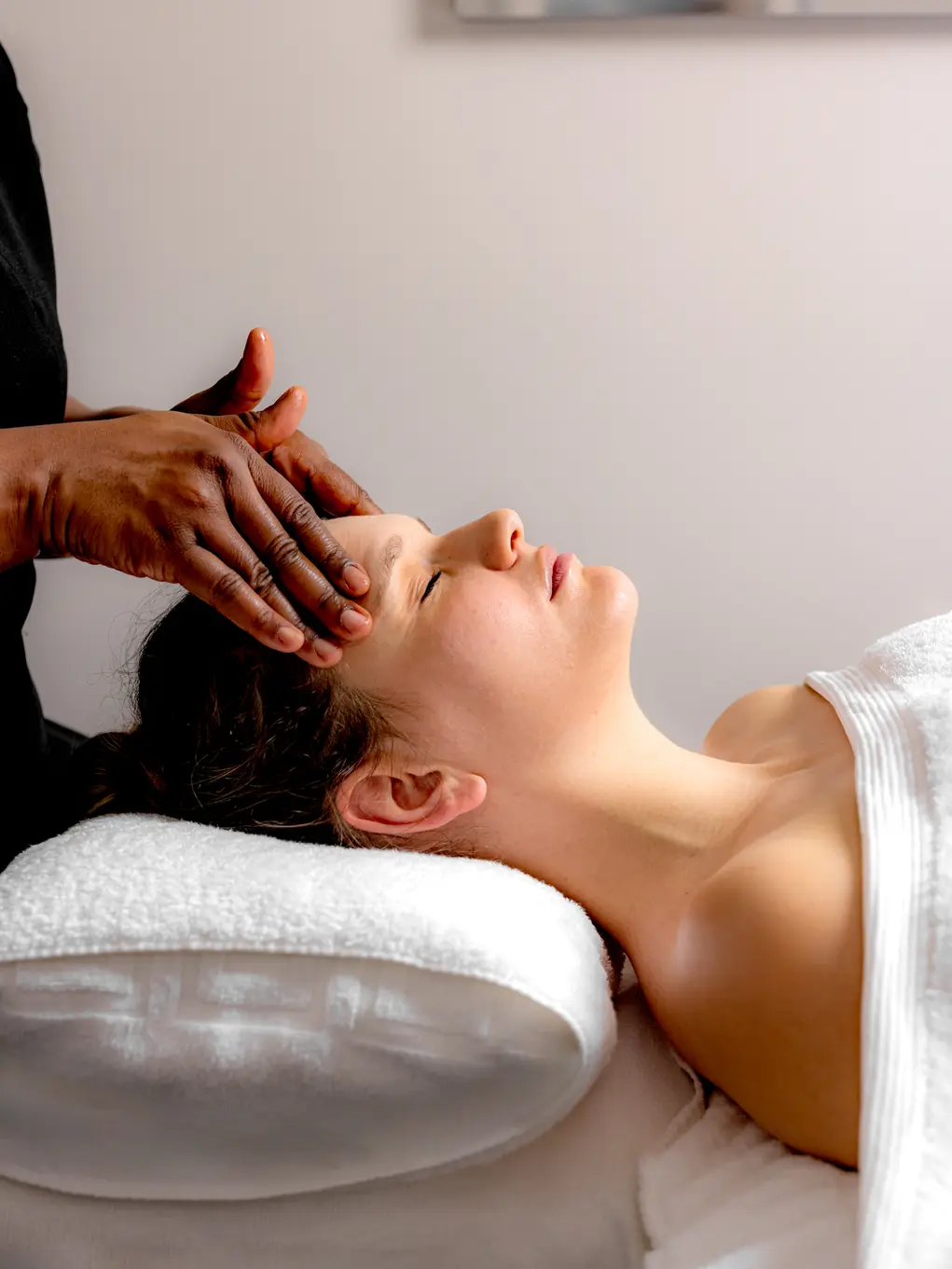 A woman getting a head massage