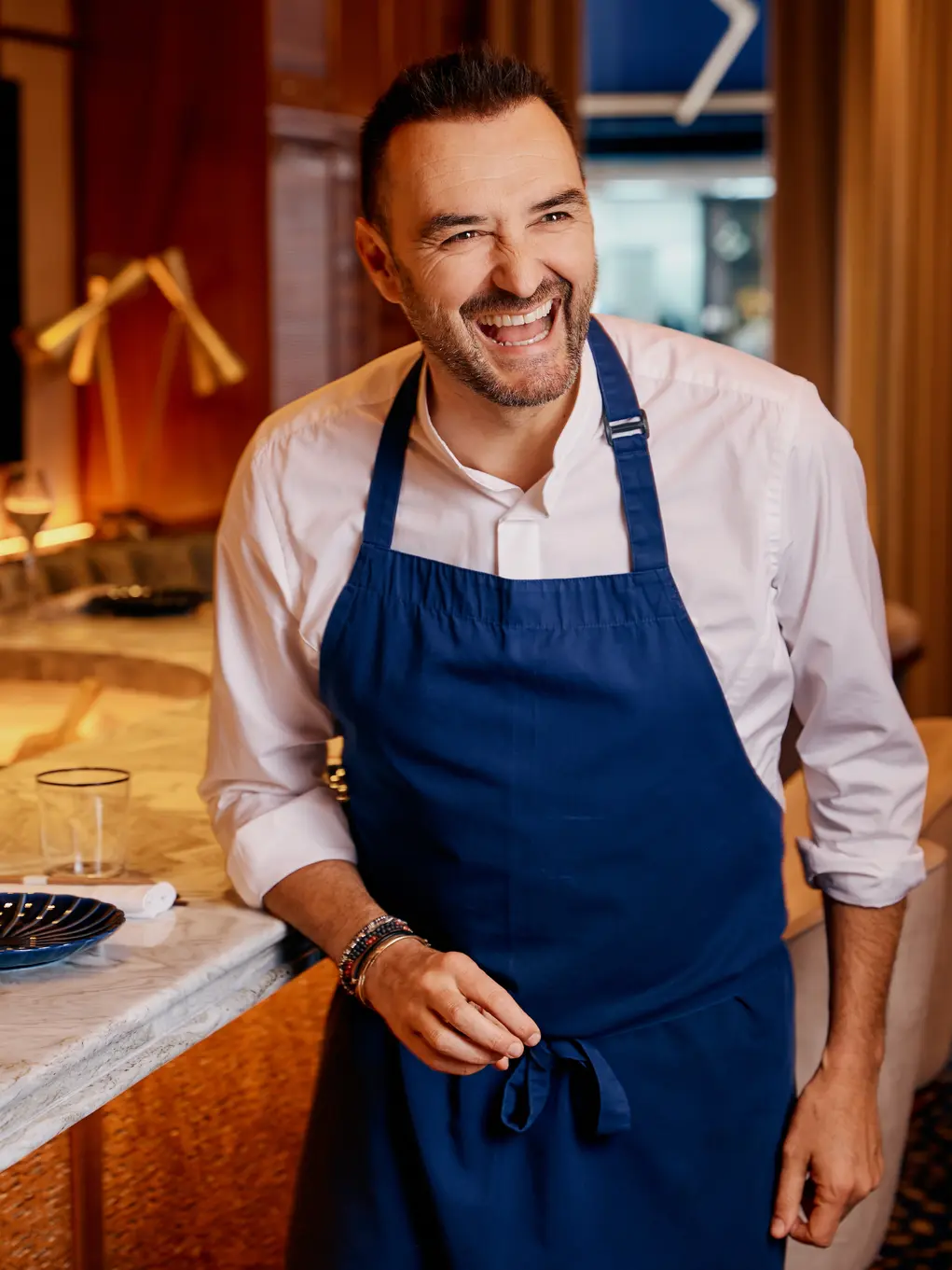 Chef in a blue apron 