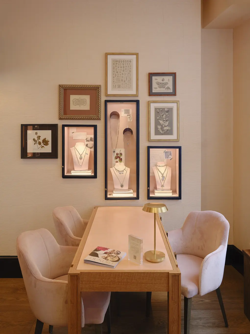 A table and chairs with pictures on the wall 