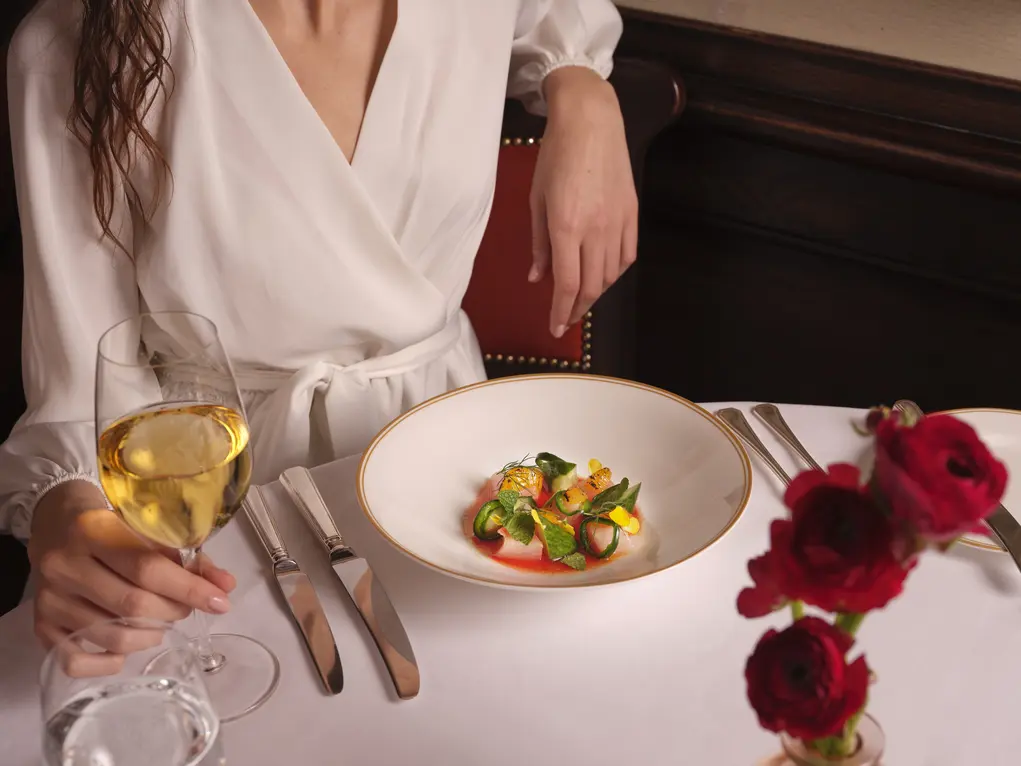 A plate of seafood and a glass of wine at 34 Mayfair