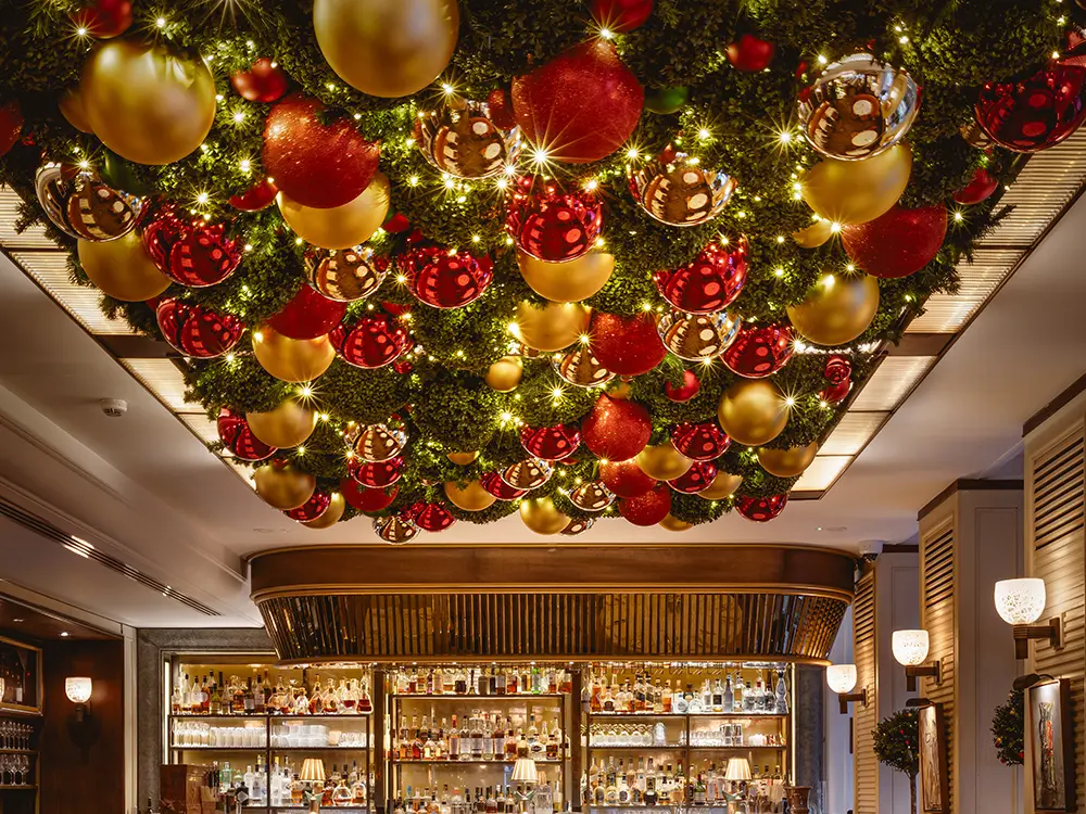 A dining room with baubles on the ceiling