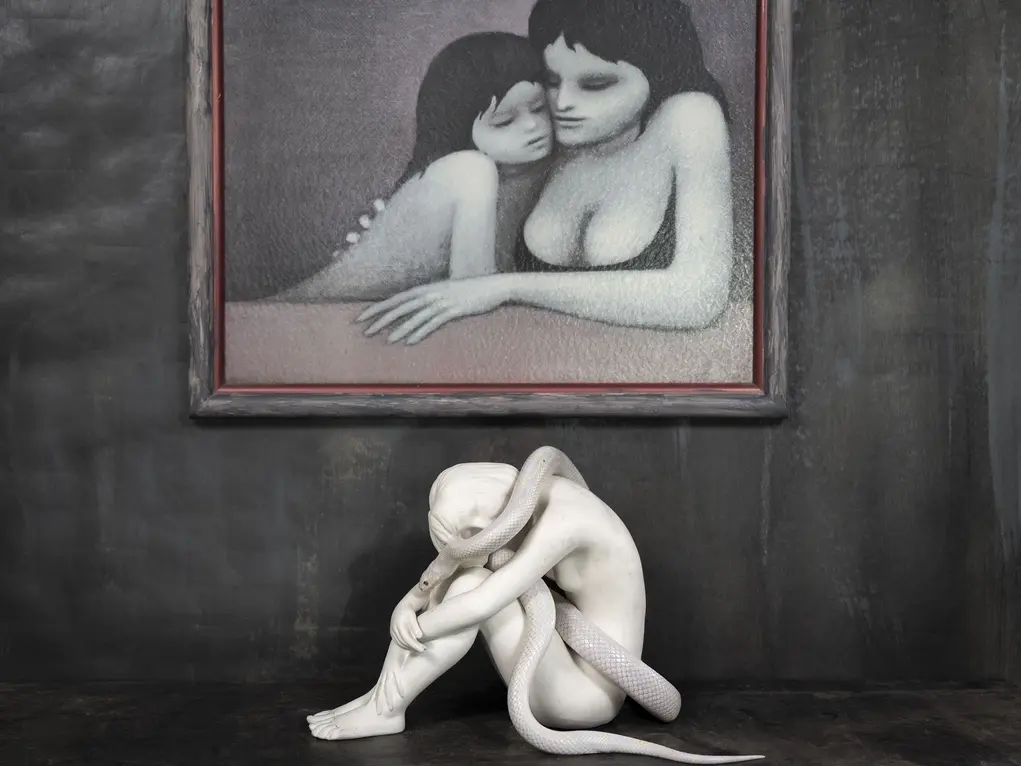 A painting of a woman and a girl hugging with a sculpture of a naked person with a serpent coiled around them