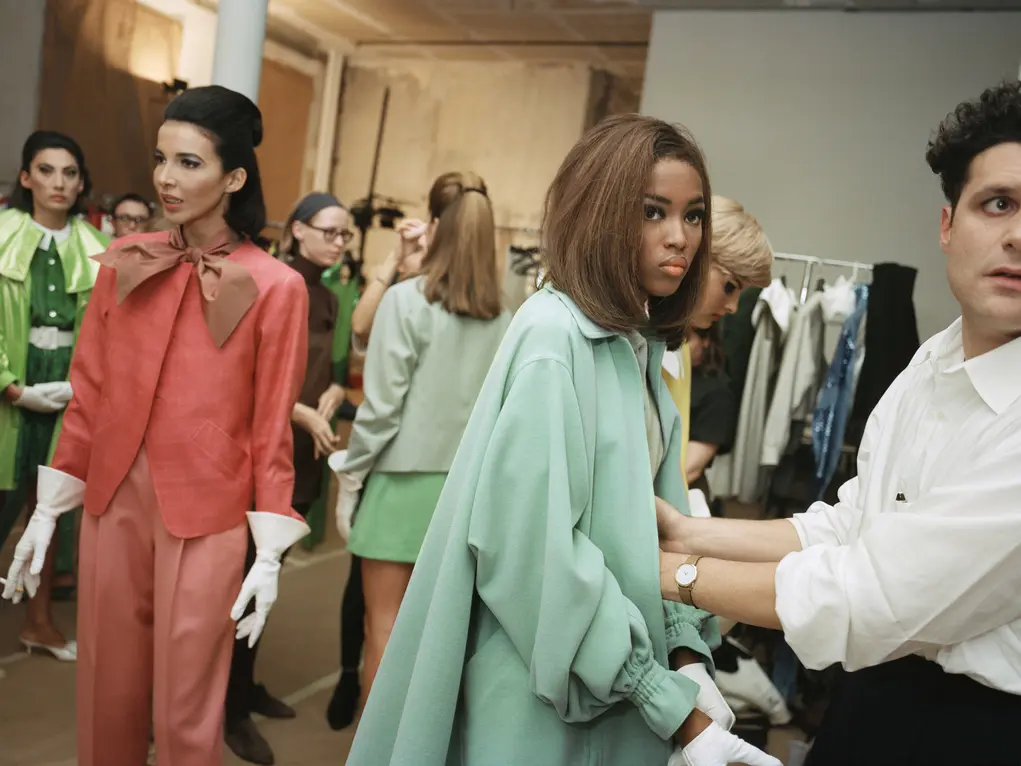 A group of women wearing colourful clothes and a man